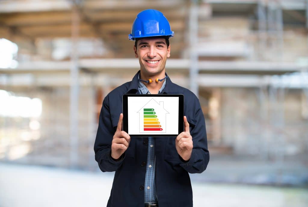 Architect Showing an Energy Efficiency Scale on a tablet device